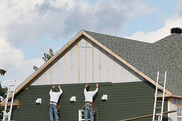 Professional Storm Damage Siding Repair technician working in Centre Hall, PA